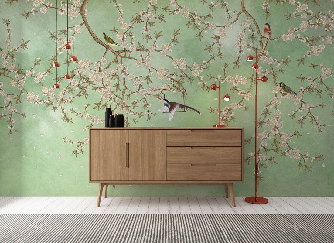 Serene Green Mural with Birds, Floral Elegance, Wooden Sideboard, Red Lamp, White Floorboards, Striped Rug.