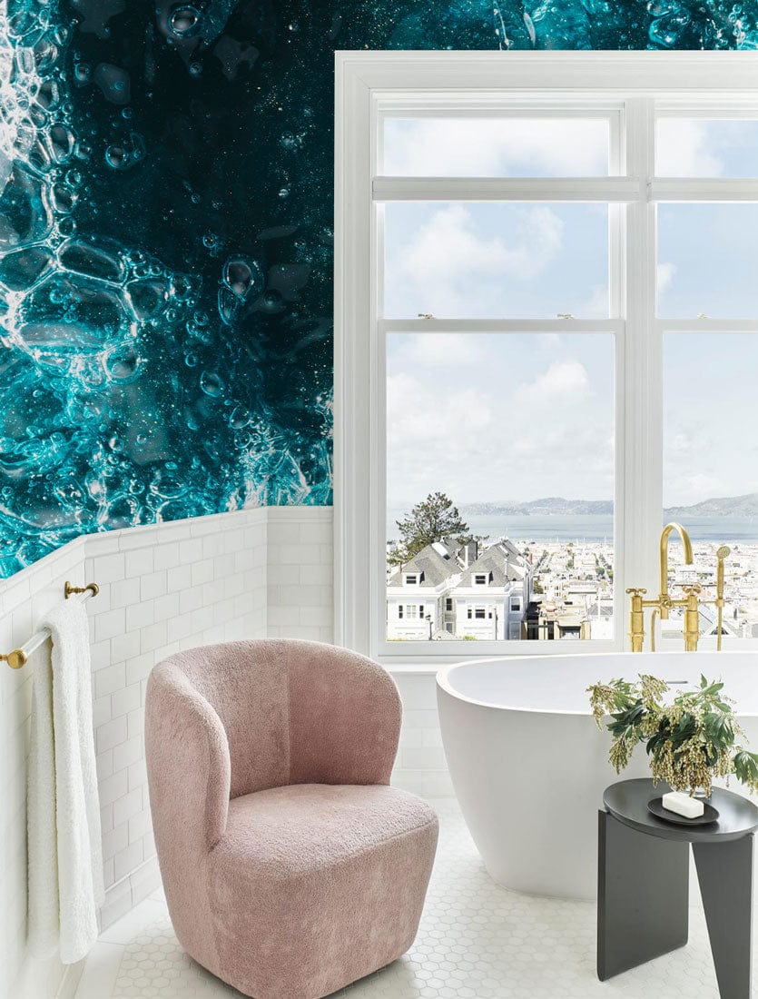 Oceanic Teal Abstract Bubbles Wallpaper, white tiles, blush chair, freestanding bathtub, luxe bathroom.