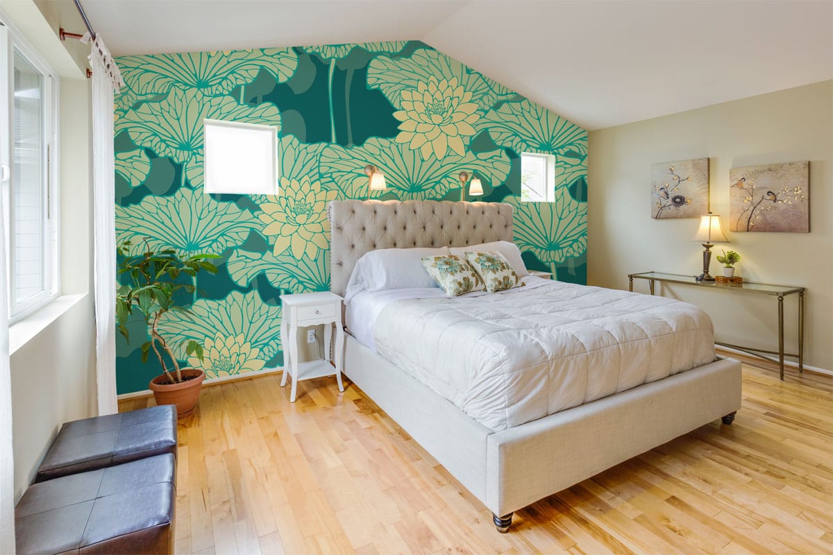 Teal and cream floral wallpaper in bright bedroom with beige bed, tan walls, hardwood floor.