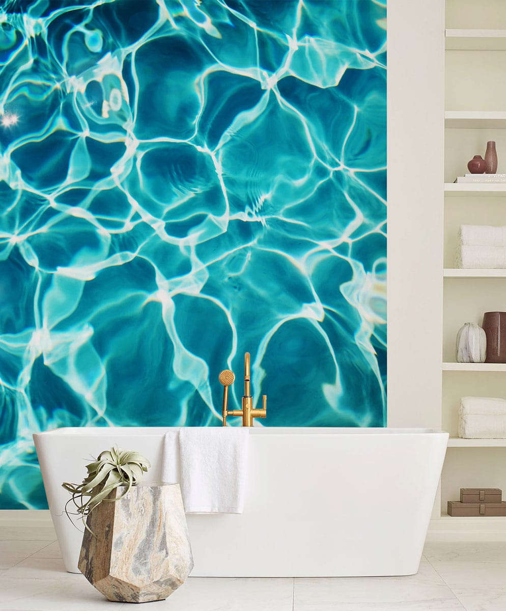 Turquoise Ripple Effect Aquatic Theme Wallpaper in bathroom with white freestanding bathtub and geometric vase.