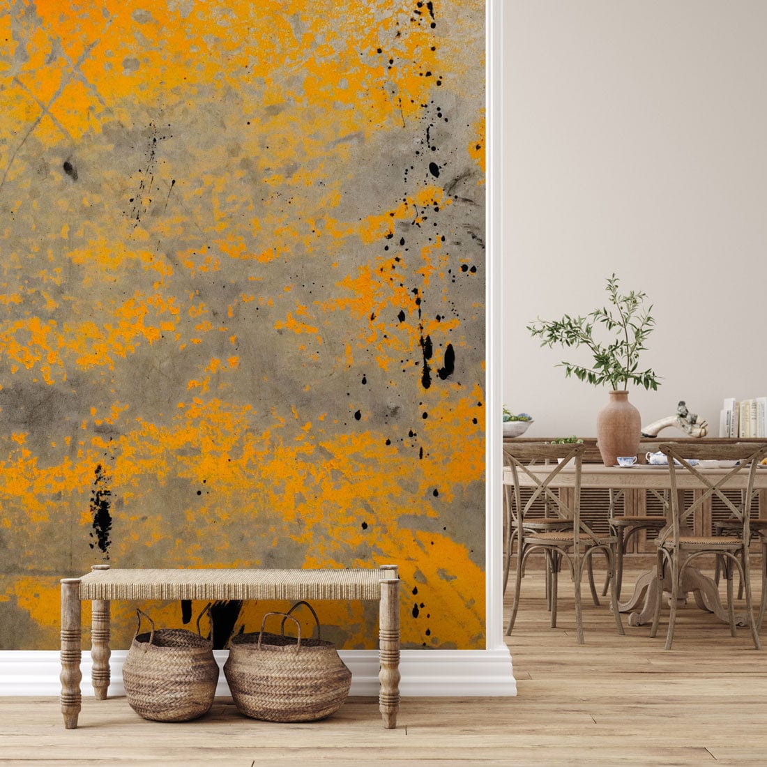 Industrial yellow and grey abstract mural, dining chairs, light wood flooring, modern room, decorative baskets.