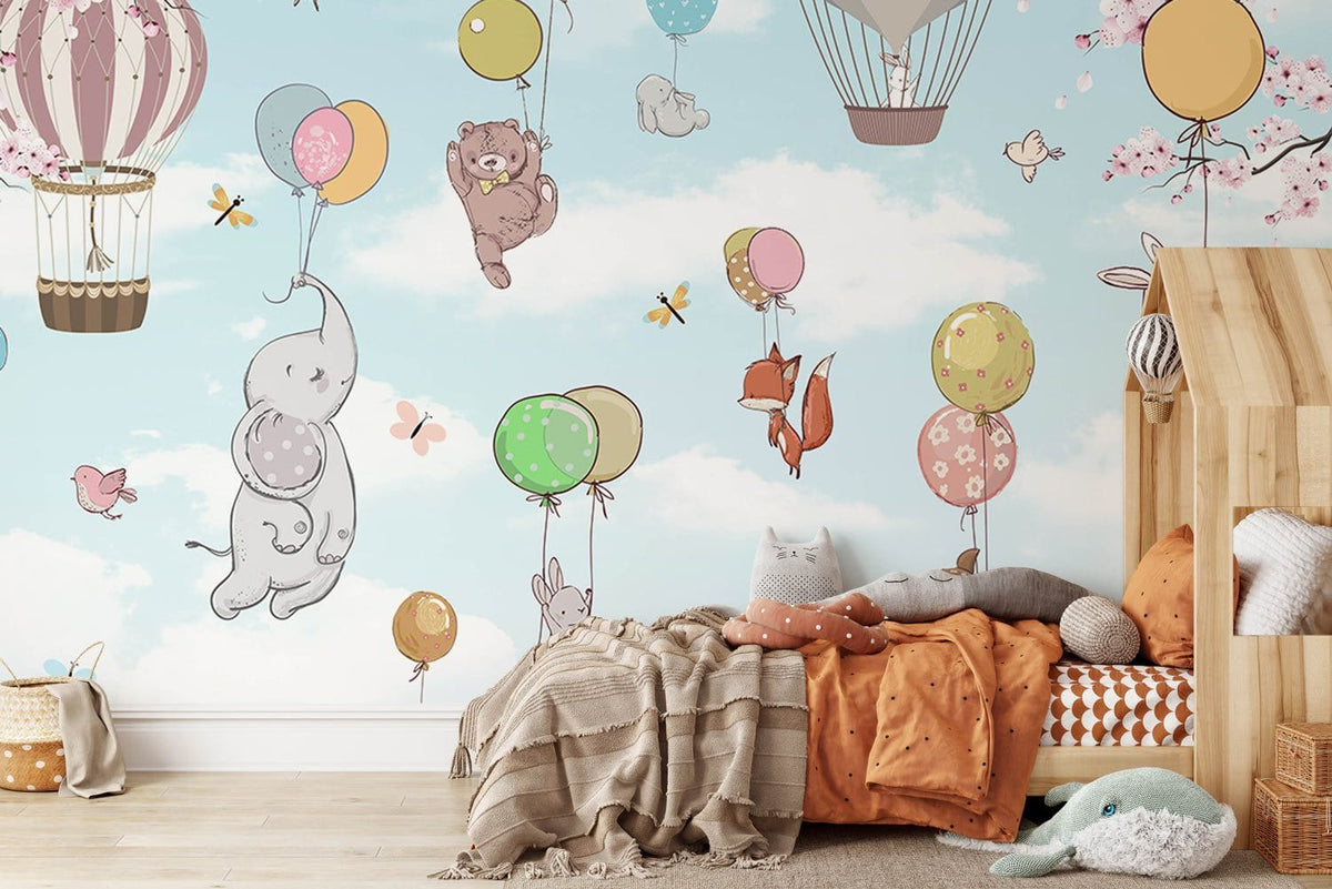 Whimsical animal balloon sky wallpaper mural in child's room with wooden bed, cosy pillows, hardwood flooring.