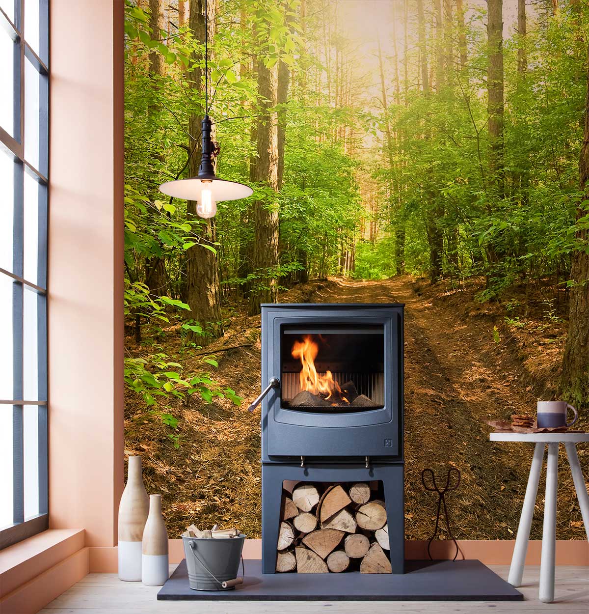 Sunlit Forest Path mural in living room, wood-burning stove, modern light fixture adds cosy ambience.