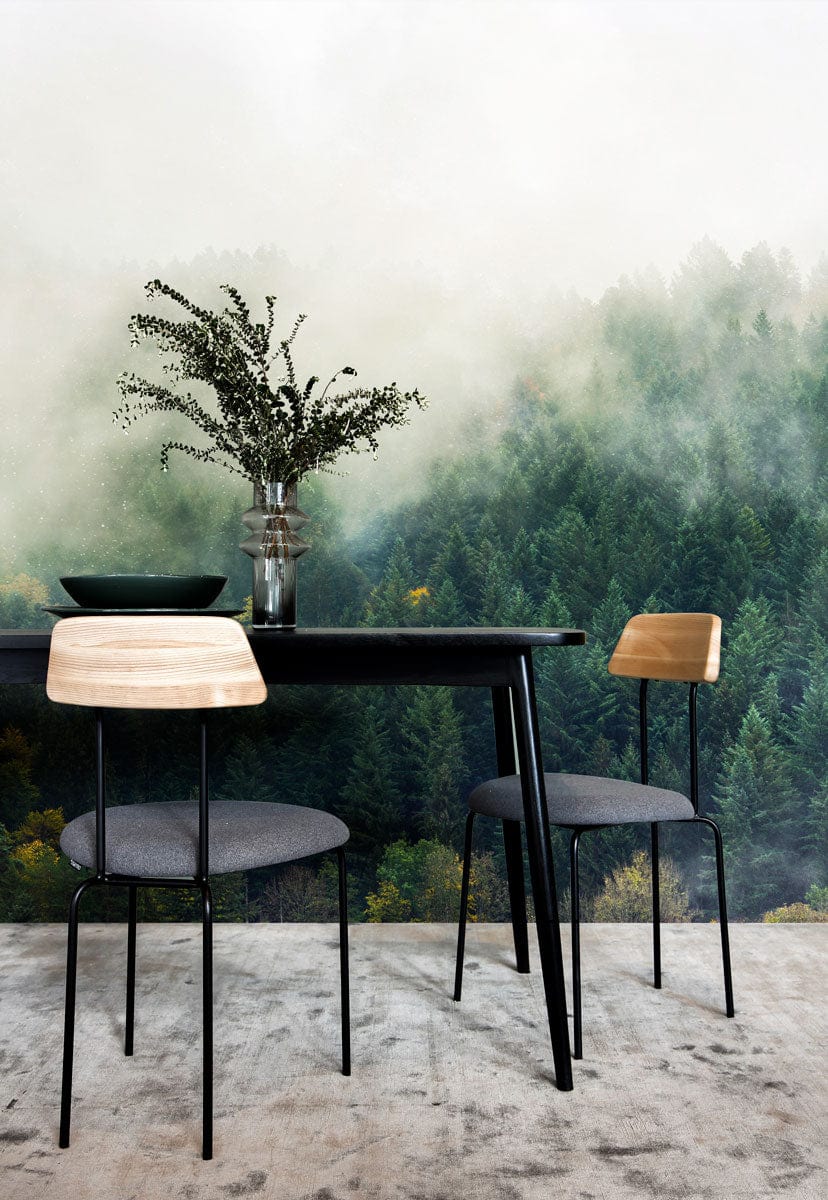 Misty Forest Green Scenic Mural Wallpaper: black table, modern chairs, grey carpet, nature-inspired decor.