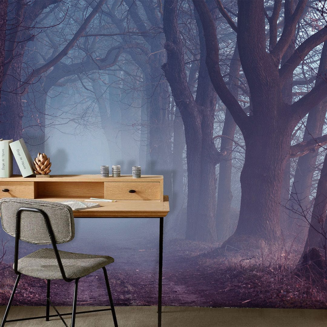 Misty Enchanted Forest Mural accentuates home office with wooden desk and grey chair, moody atmosphere.