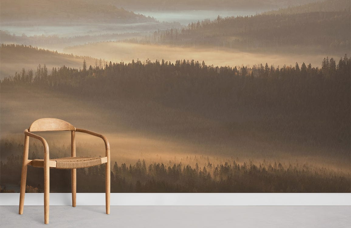 Tranquil Sunrise Mural Wallpaper in golden misty forest, minimalist wooden chair on grey floor.