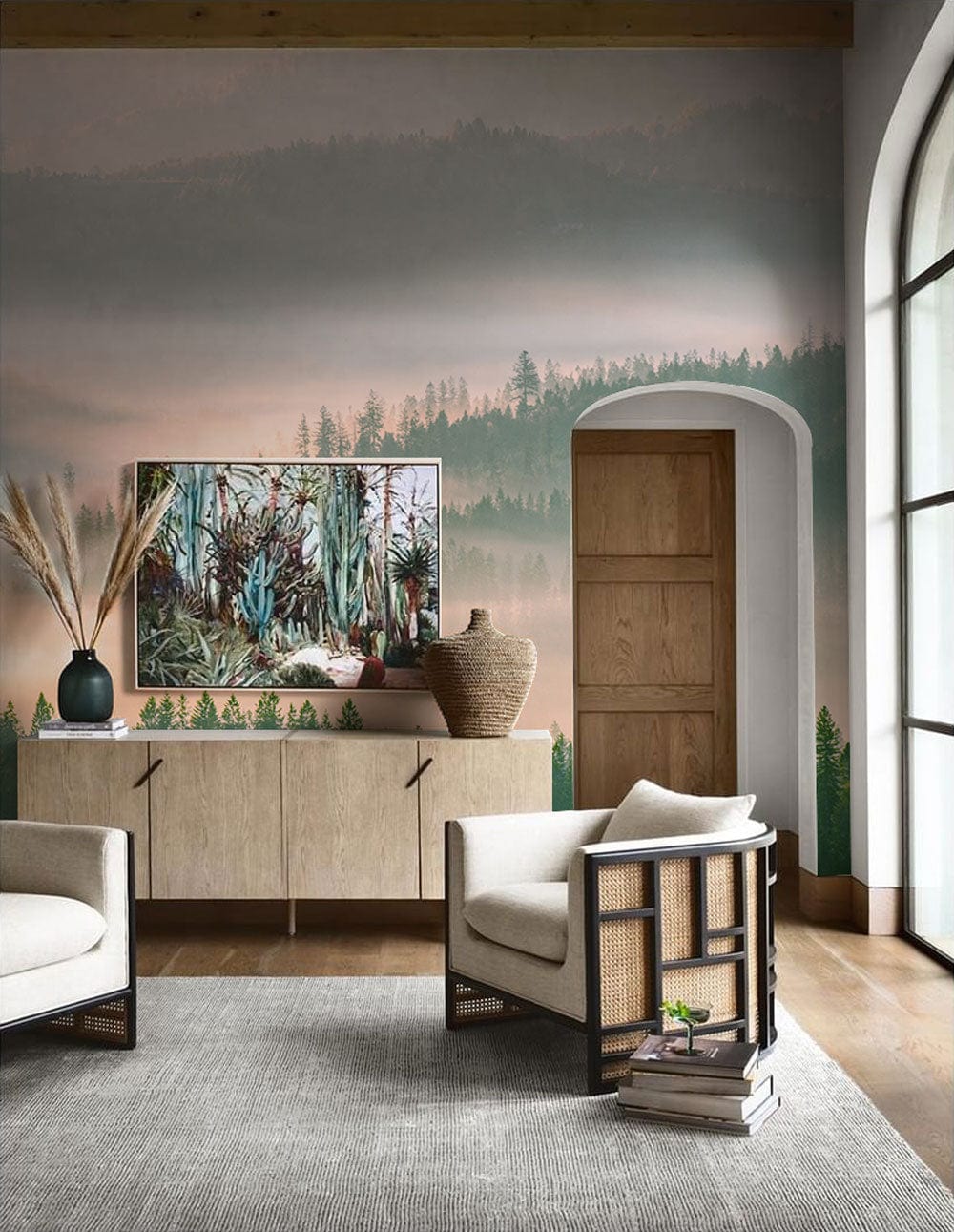 Serene Misty Mountain mural wallpaper, pastel hues, wooden floor, beige sofas, modern room setting, wall art.