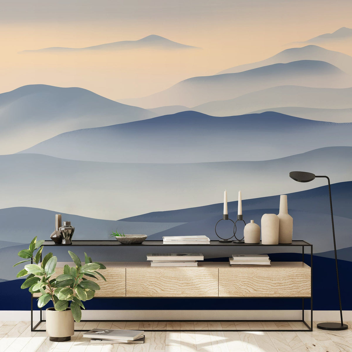 Serene blue mountain mural wallpaper; calm decor with wooden console, black accents, and serene style.