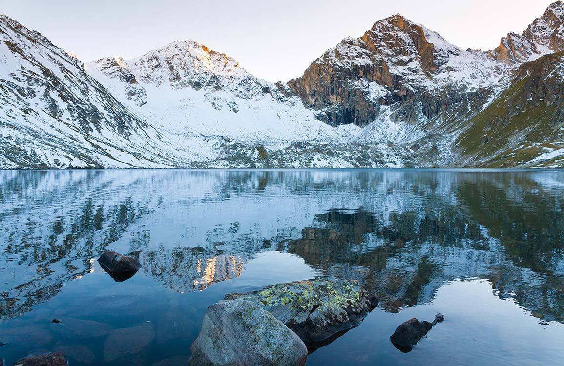 Scenic Alpine Lake and Snowy Mountain Landscape Mural Wallpaper in Serene Blue