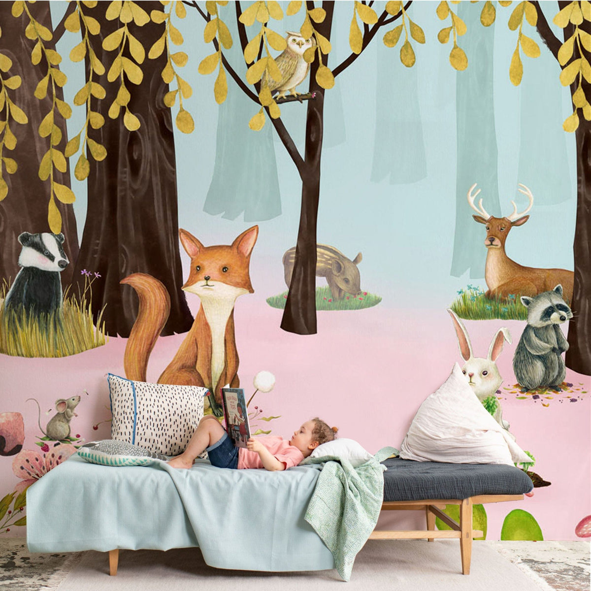 Whimsical woodland mural wallpaper in pastel, children's room, grey sofa, soft rug, playful forest animals.