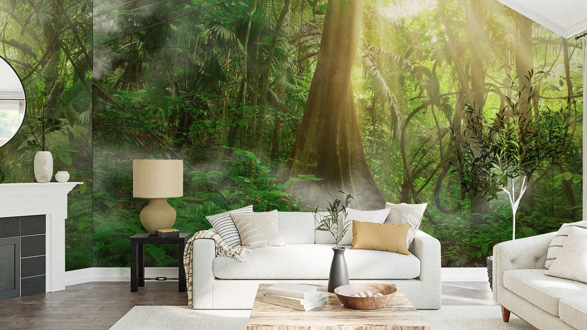 Serene Sunlit Jungle Path mural wallpaper in living room with white sofas, wooden table, and lamp.