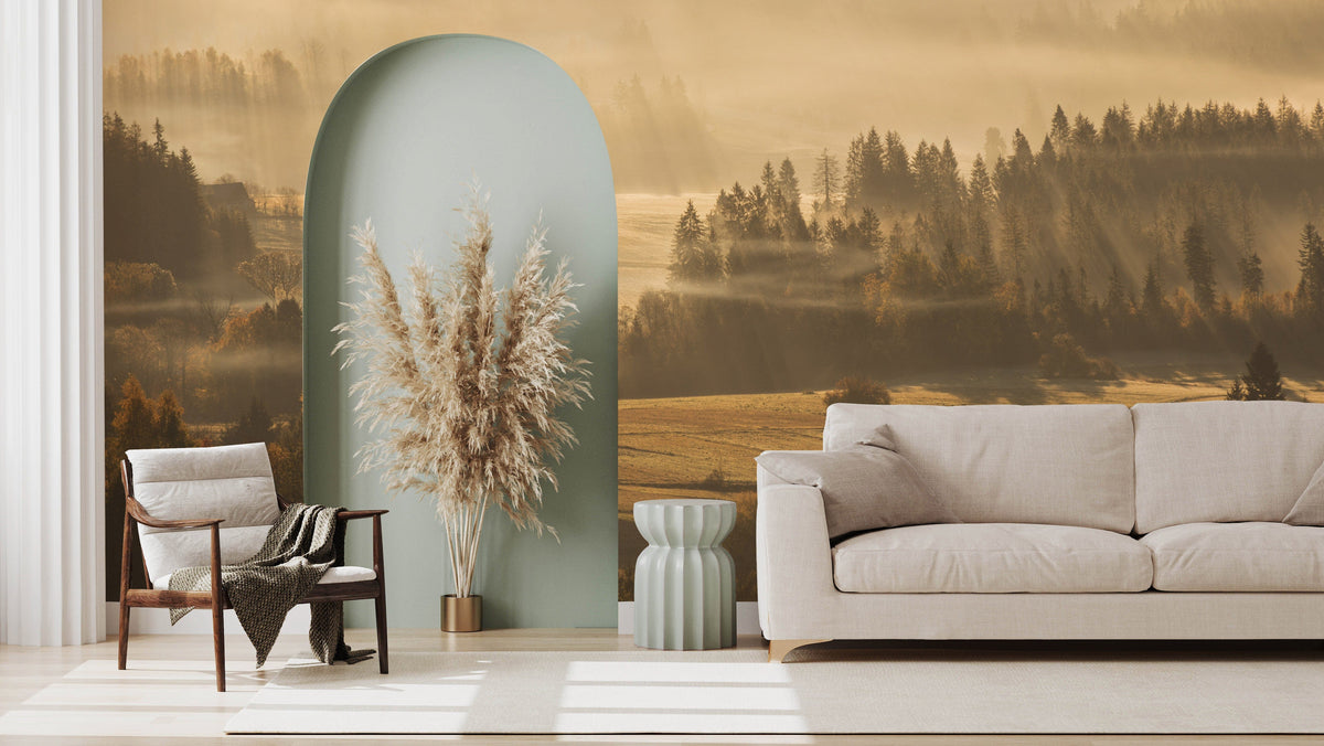 Golden Sunrise Forest Landscape Mural Wallpaper in living room with beige sofa, grey-green accent wall.