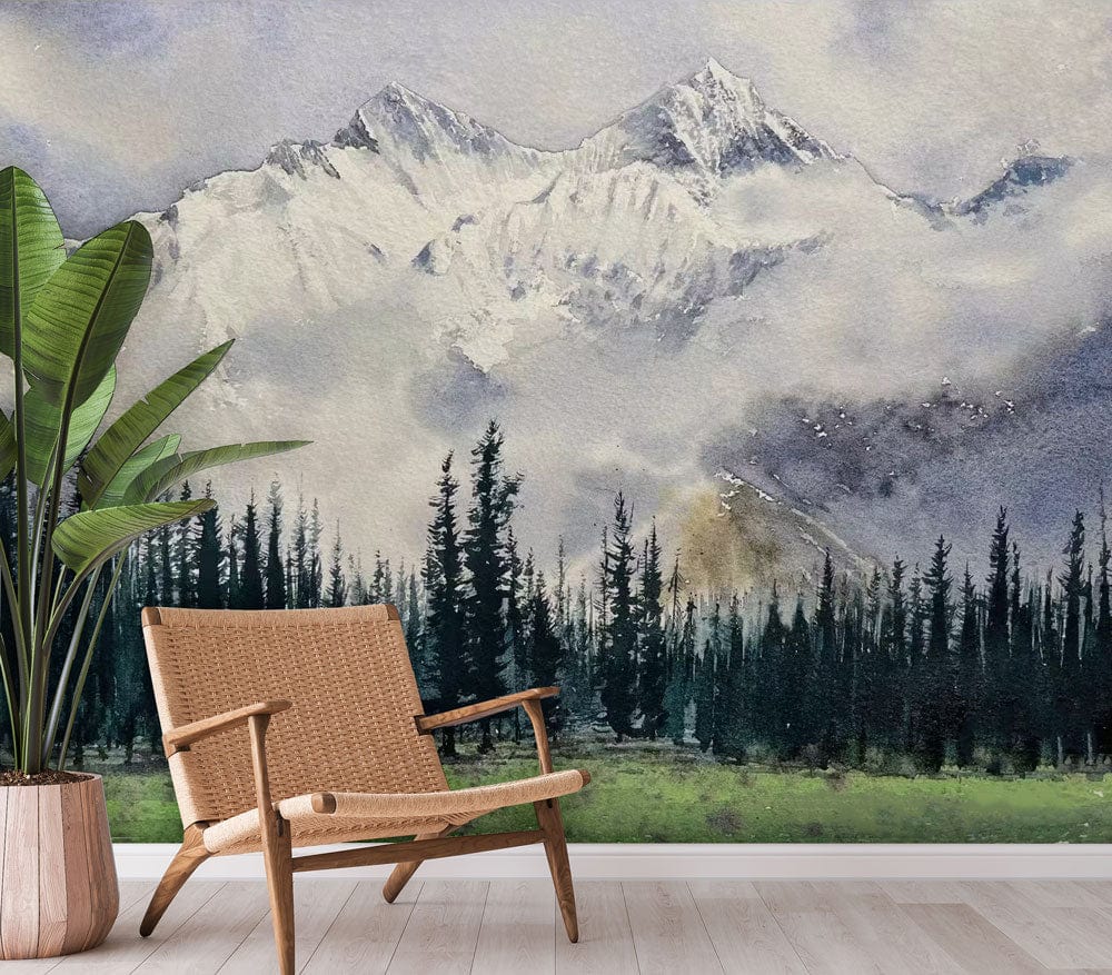 Mountain landscape watercolour mural wallpaper in soft greens and greys, rattan chair, wooden flooring.