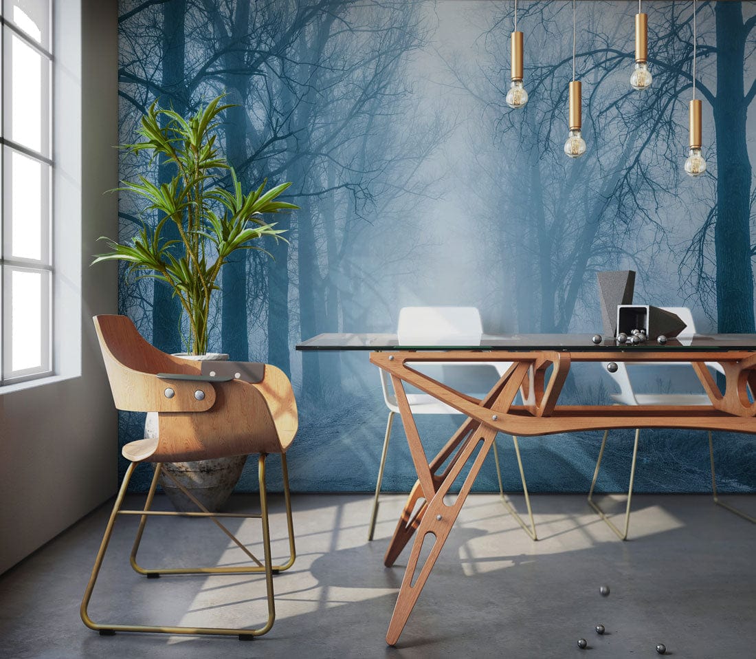 Ethereal Misty Forest Path Mural Wallpaper in office with modern chair, glass table, and pendant lights.