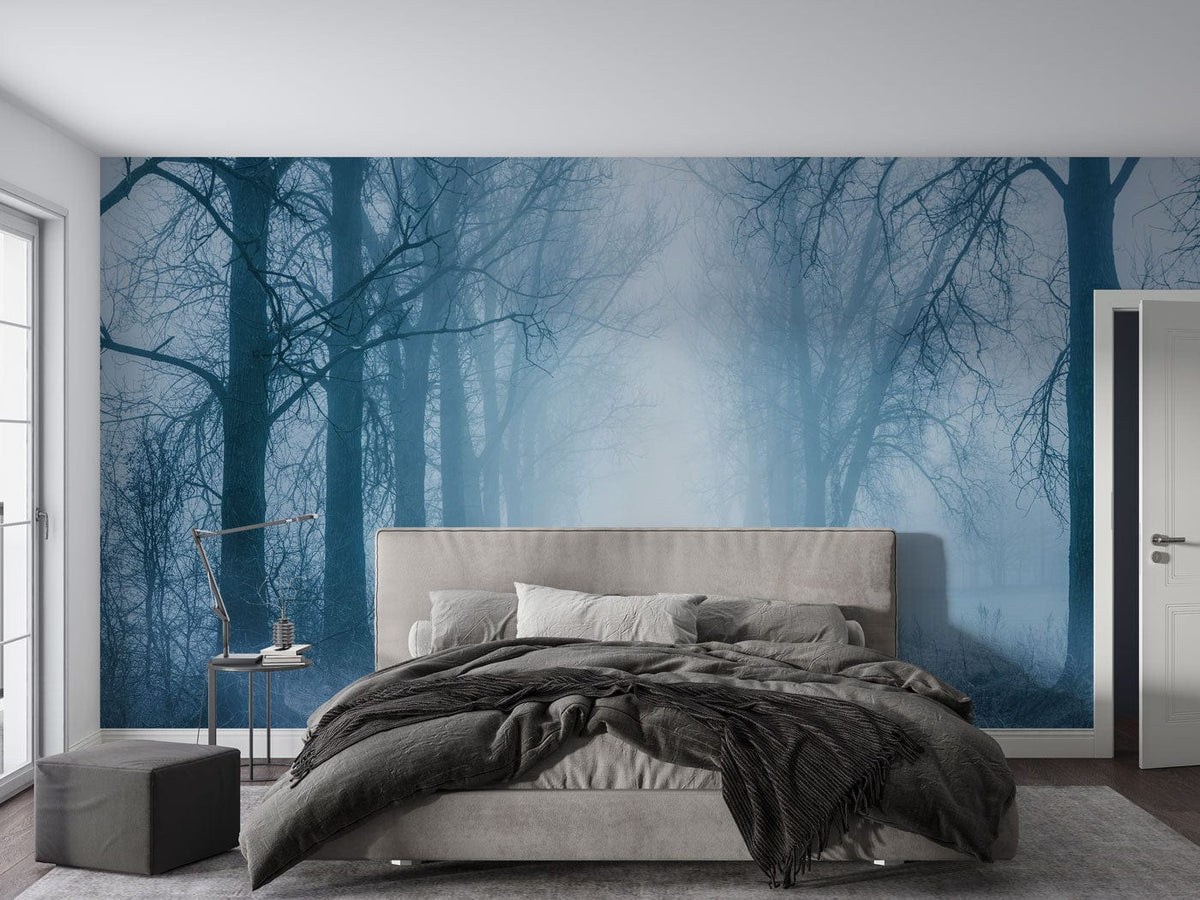 Ethereal Misty Forest Mural in bedroom with grey bed, modern design, tranquil blue atmosphere.