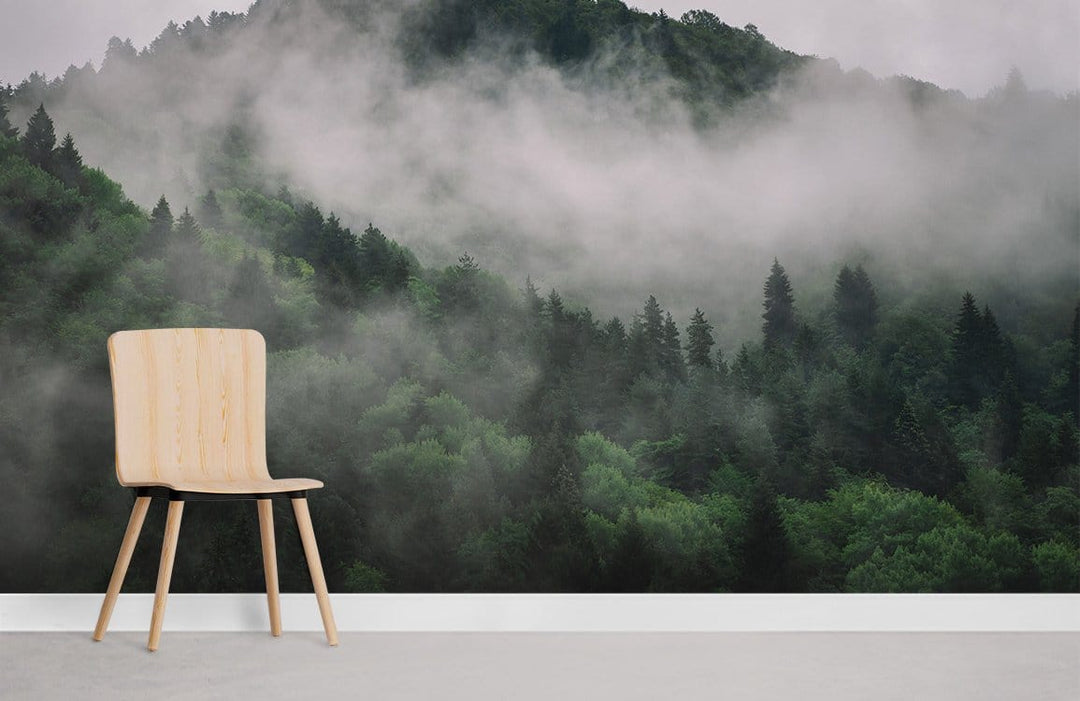 Enchanted Misty Forest mural with natural wood chair and white skirting in serene room setting.