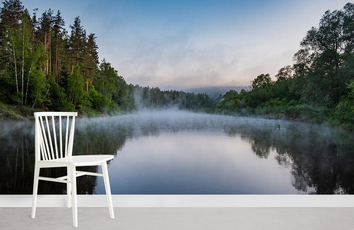 White chair on grey floor with Serene Misty River Forest Landscape Mural Wallpaper, nature wall art.