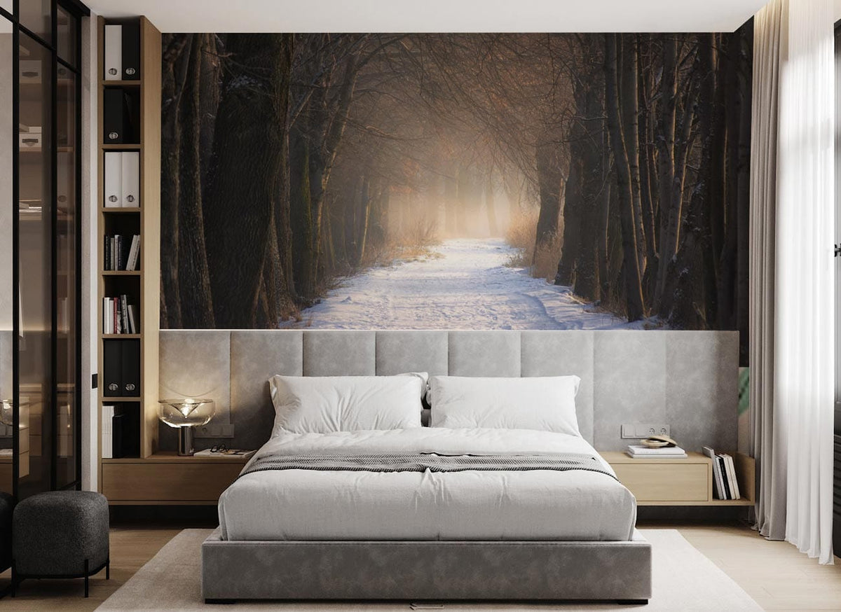 Enchanted Winter Woodland Path mural wallpaper in bedroom with grey upholstered bed, wooden flooring.