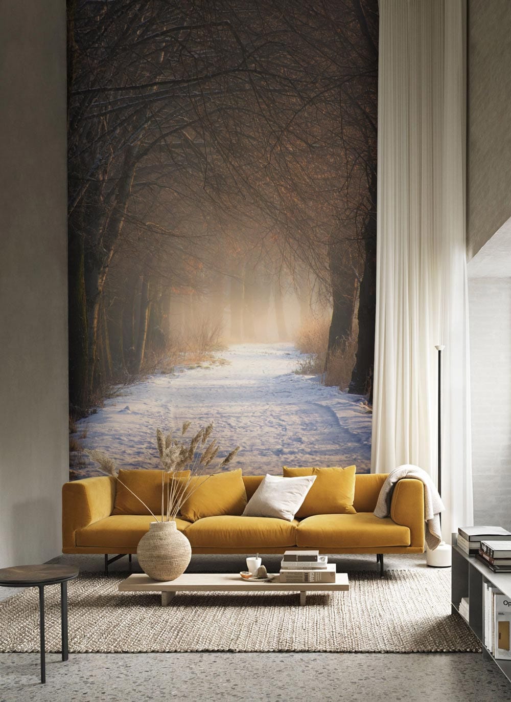 Cosy living room with Enchanted Winter Woodland Path mural, mustard sofa, textured rug, and parquet flooring.