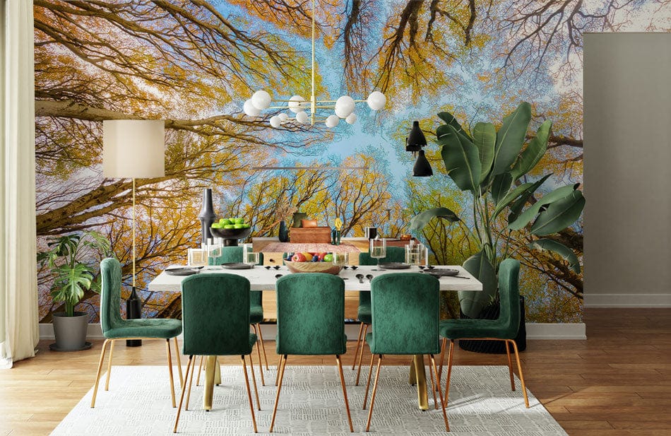 Autumn Canopy mural wallpaper in dining room with green chairs, wooden flooring, and modern lighting.
