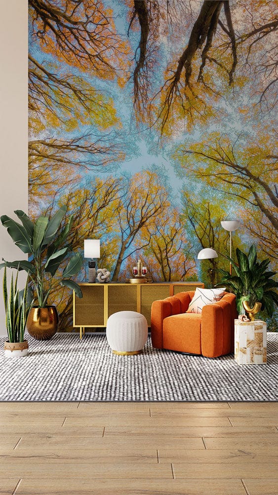 Autumn Canopy mural wallpaper with orange sofa, wooden flooring, and modern decor elements in living room.