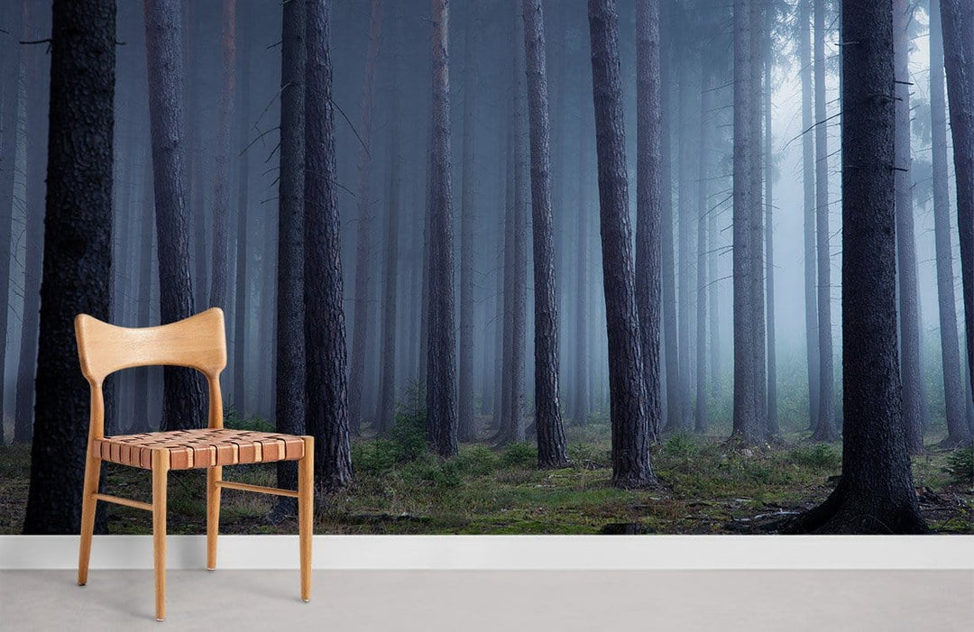 Mystical Misty Forest Mural Wallpaper: Enchanting woodland scene with wooden chair on light floor.