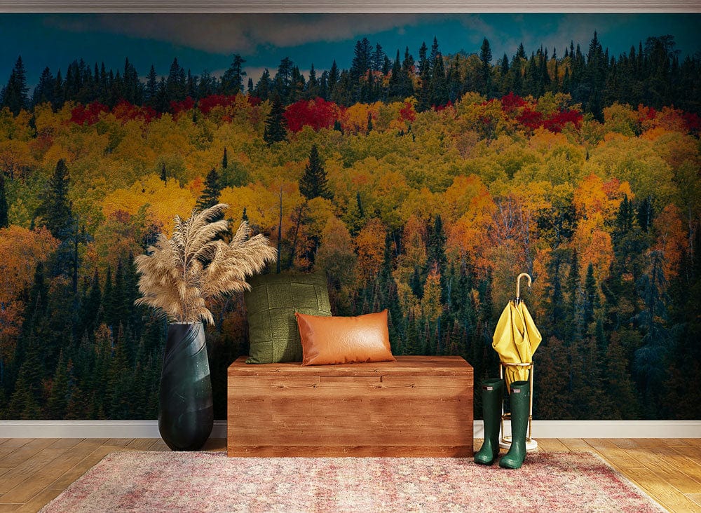 Vibrant autumn forest mural wallpaper in living room with wooden bench, green boots, and rug.