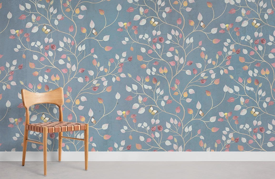 Vintage blue botanical wallpaper with autumn leaves design, wooden chair, grey flooring, elegant decor.