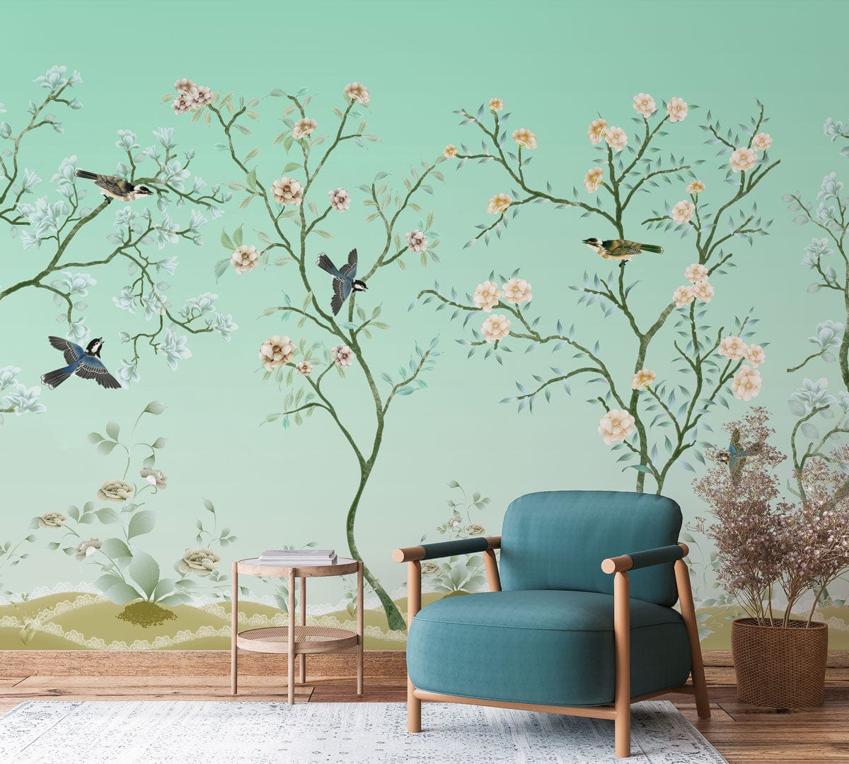 Chinoiserie mural wallpaper, mint green, floral and bird design, with teal armchair and wooden flooring.