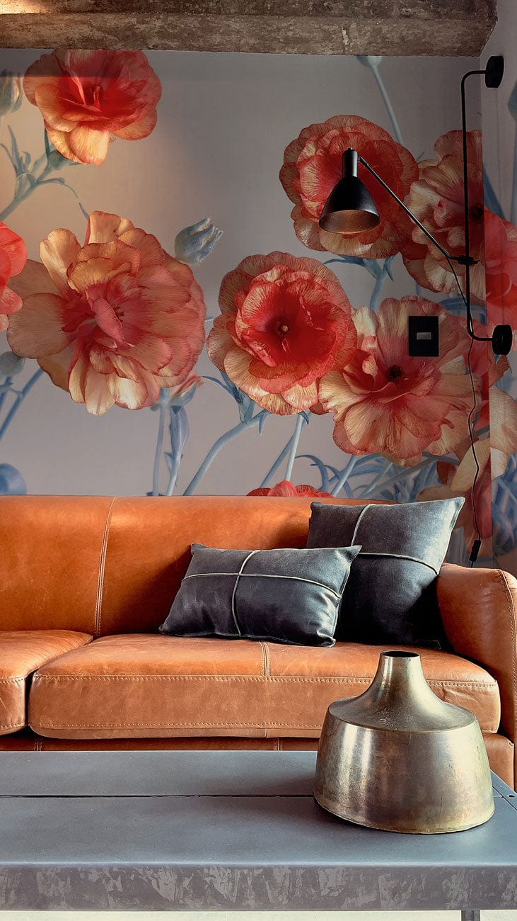 Vintage coral floral mural wallpaper, soft blue accents, brown leather sofa, modern industrial lamp.