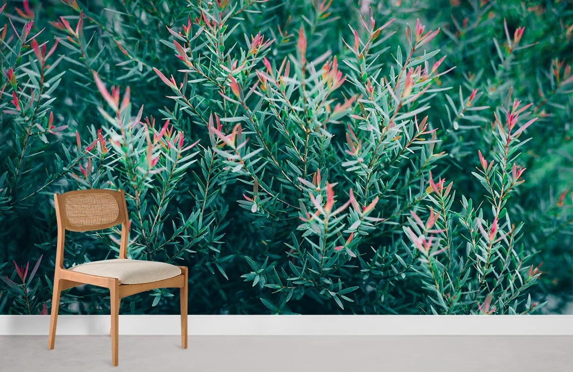 Vibrant green and pink botanical mural with beige wooden chair, neutral carpet in living room setting.