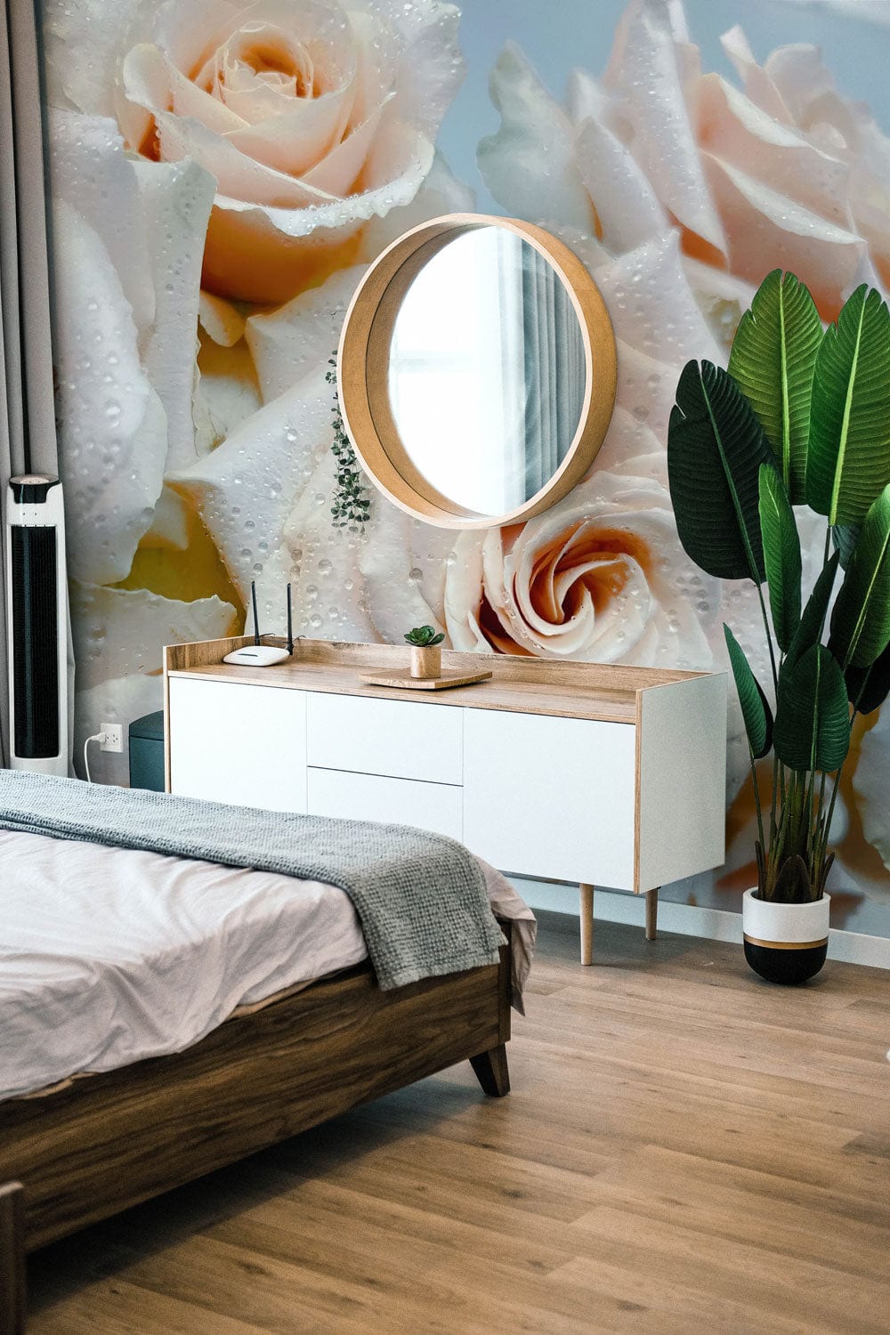 Elegant Cream Rose Blooms wallpaper in modern bedroom with wood flooring, white sideboard, and round mirror.
