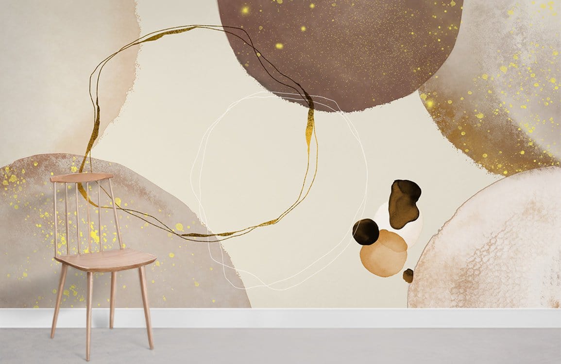 Elegant Earthy Tones Abstract Circle Pattern Mural Wallpaper with Gold Accents, wooden chair, neutral room.