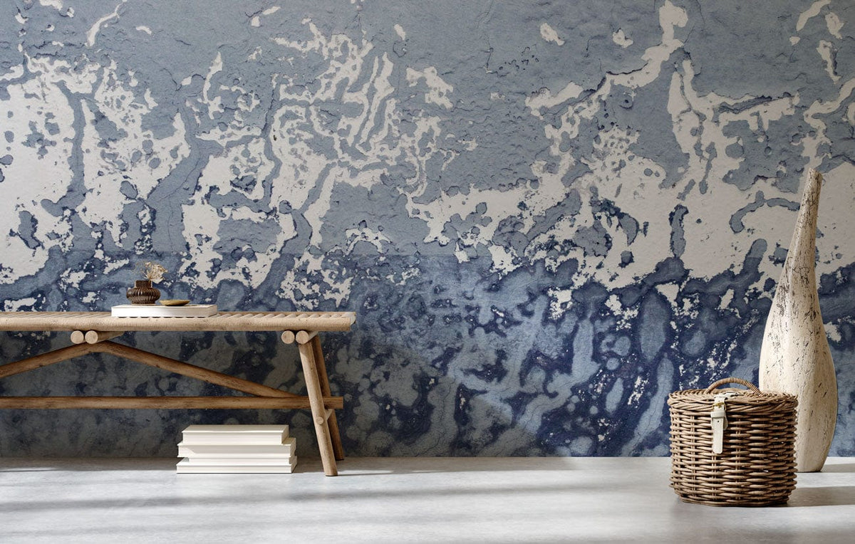 Abstract Oceanic Wash mural wallpaper, cool grey tones. Rustic bench, wicker basket, concrete flooring.