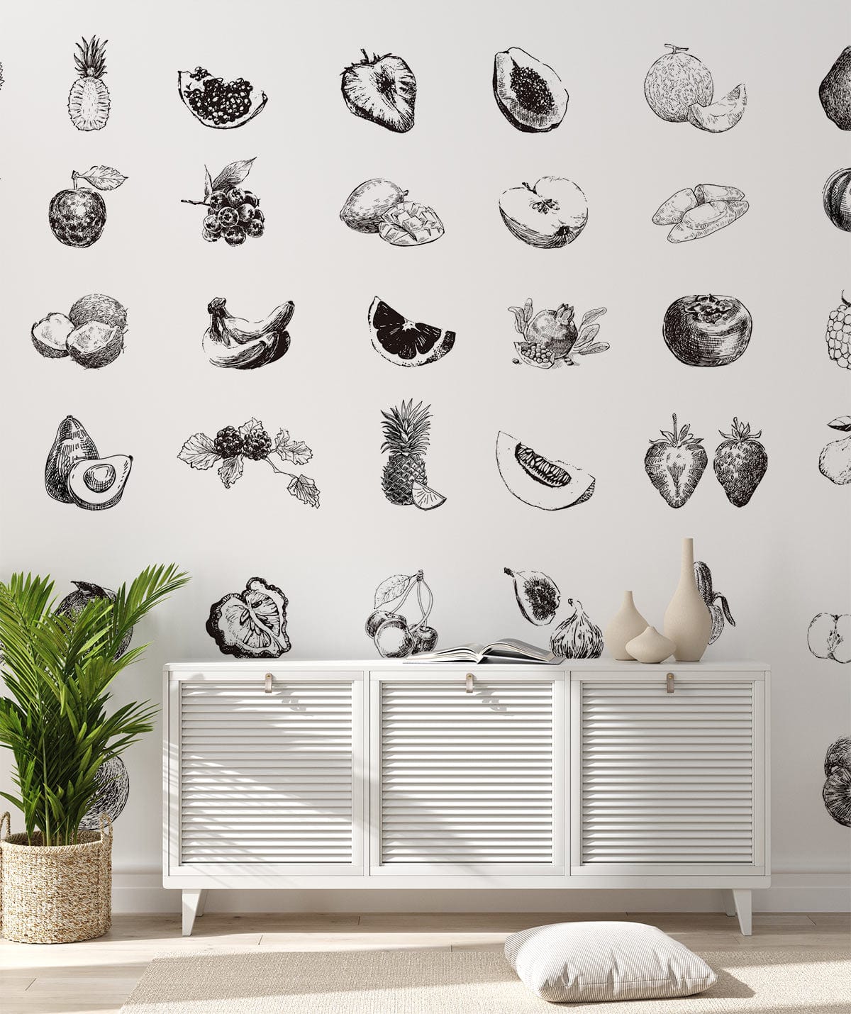 Monochrome fruit sketch wallpaper in classic interior with white sideboard, light wood flooring, green plant.