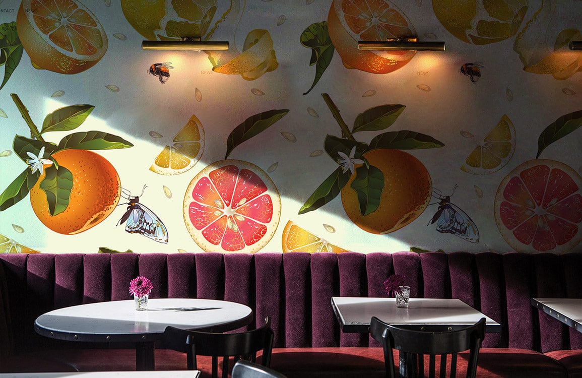 Tropical Citrus Paradise Wallpaper with oranges, lemons; art deco sofa, round tables in dining room.