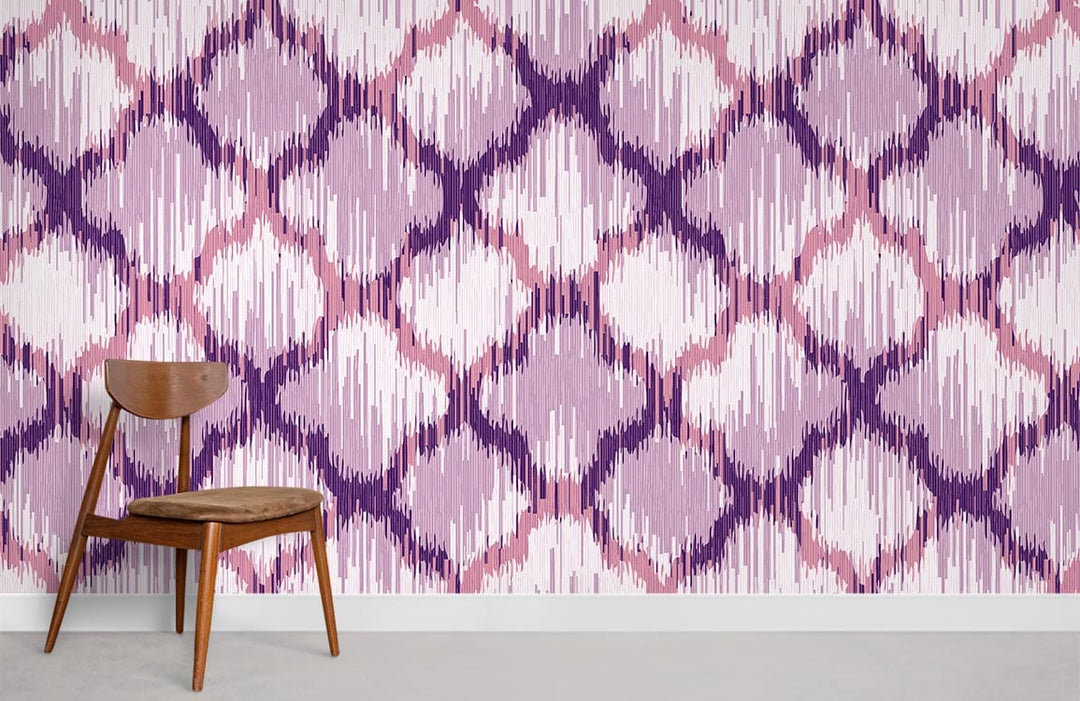 Elegant lilac and pink geometric Ikat pattern wallpaper with wooden chair, neutral flooring.