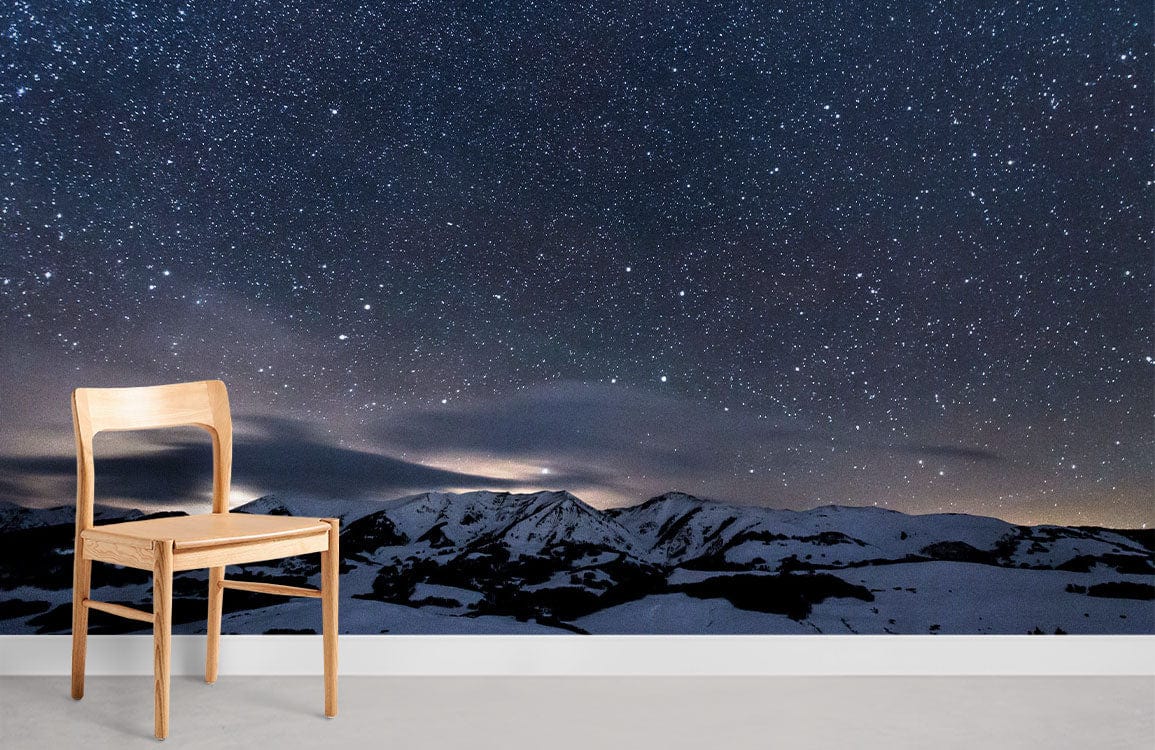 Starry Night Sky Mural in living room with wooden chair, grey flooring, Dark Blue Serenity wallpaper.