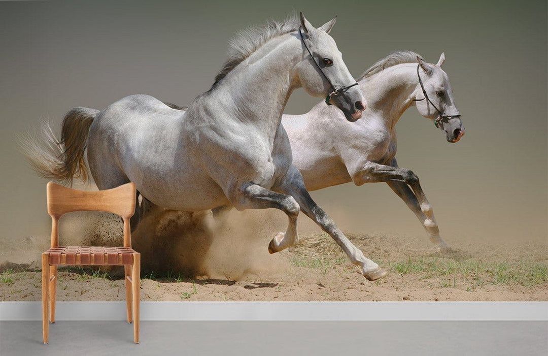 Galloping Grey Horses Mural Wallpaper in living room with wooden chair, grey flooring, and neutral walls.