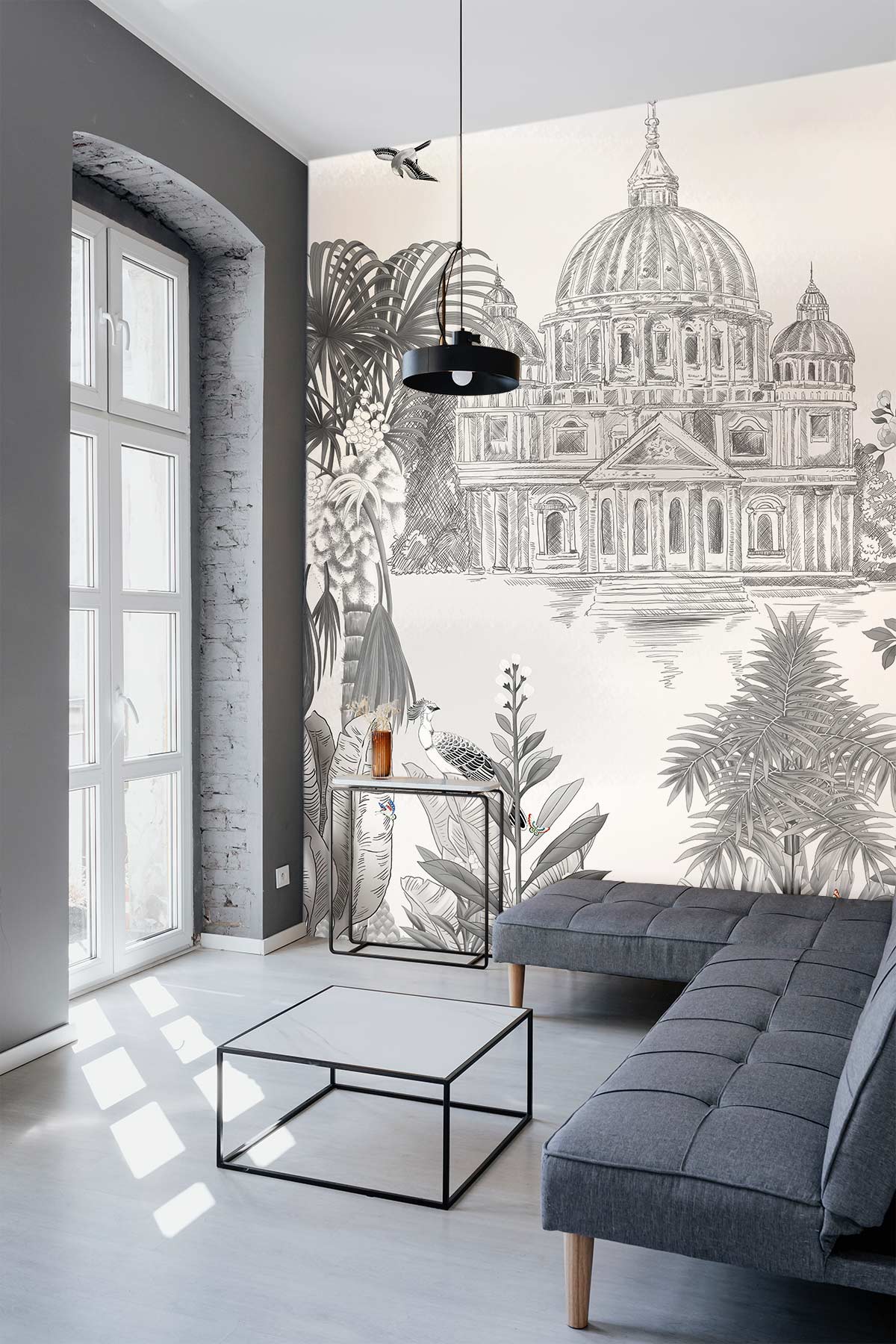 Vintage botanical parrot mural in grey, orange; modern grey sofa, light wood flooring, living room.