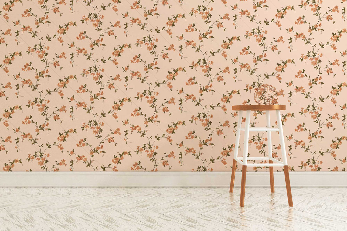 Vintage floral wallpaper with delicate flowers, soft beige hue; simple wooden stool, light herringbone flooring.
