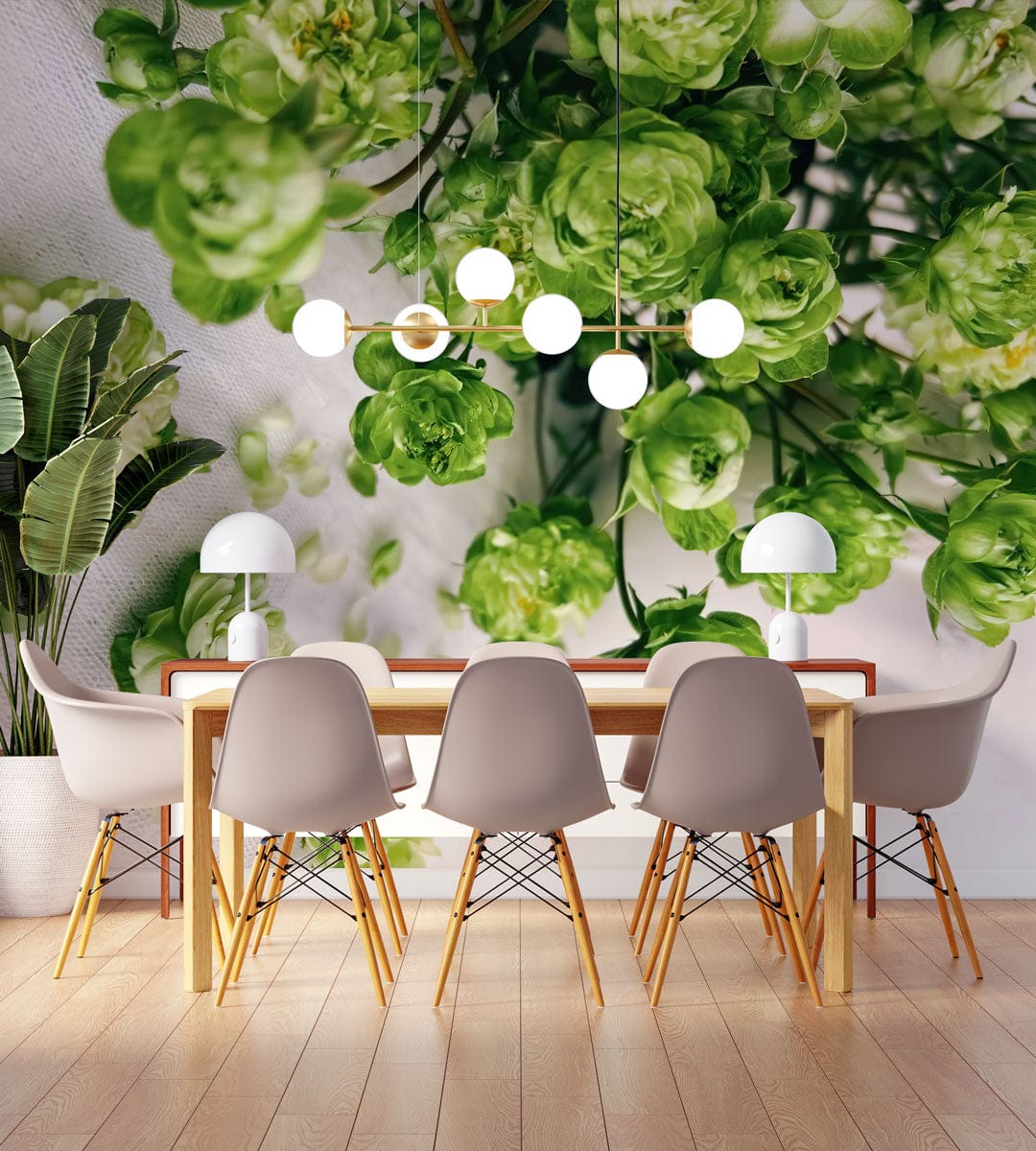 Elegant green floral wallpaper in dining room with modern table, grey chairs, and wooden flooring.