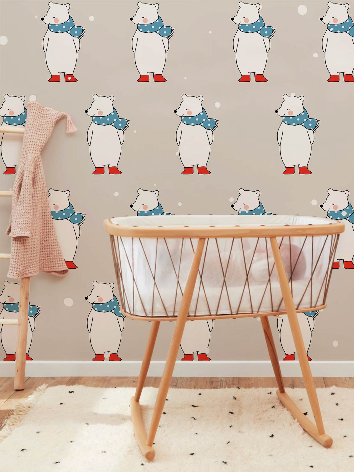 Cosy Winter Polar Bear wallpaper; nursery room setting with wooden cot; beige walls.