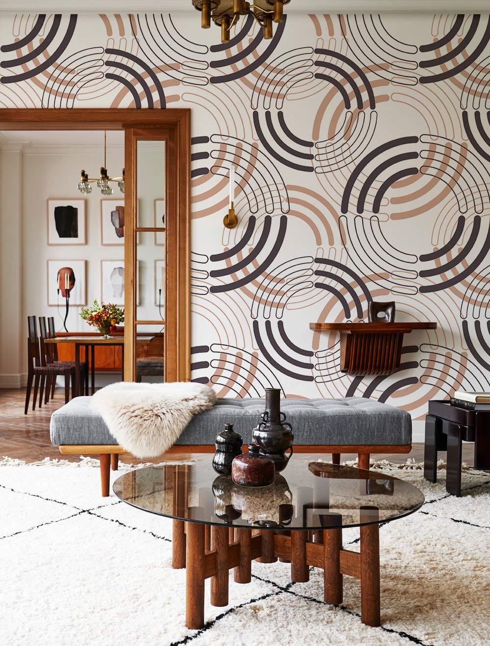 Retro Earthy Tones Geometric Wallpaper in vintage-style lounge with grey sofa and modern wooden table.