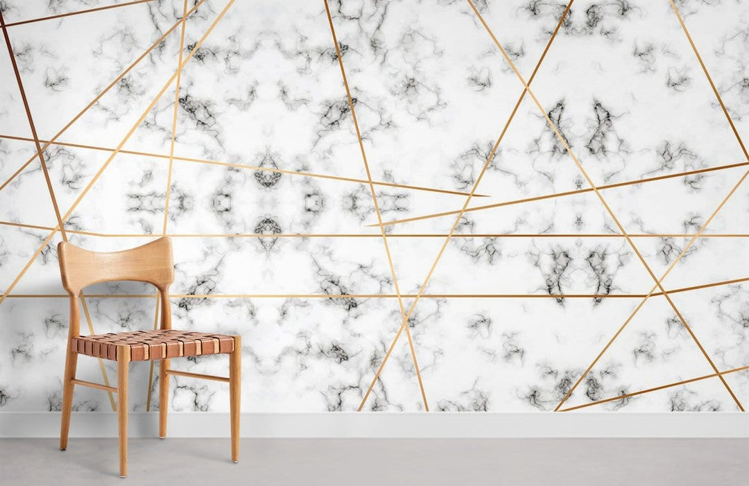 Luxurious marble effect mural wallpaper, gold geometric design, modern wooden chair, grey flooring.