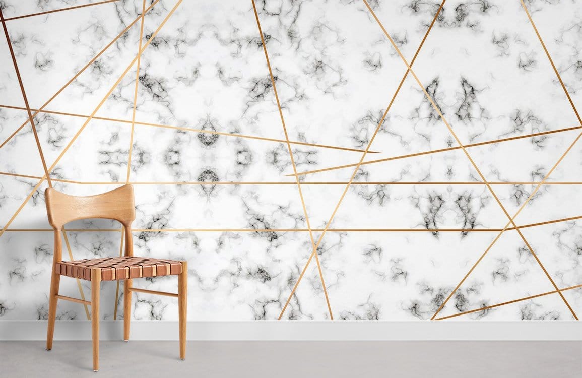 Luxurious marble effect mural wallpaper, gold geometric design, modern wooden chair, grey flooring.