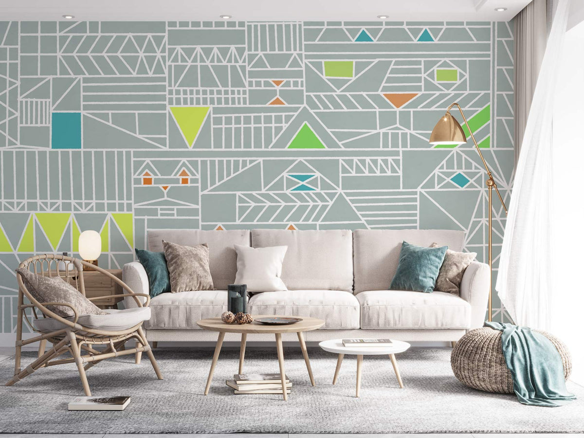 Geometric Abstract Pattern Wallpaper in soft grey with colourful accents, beige sofa, grey carpet.