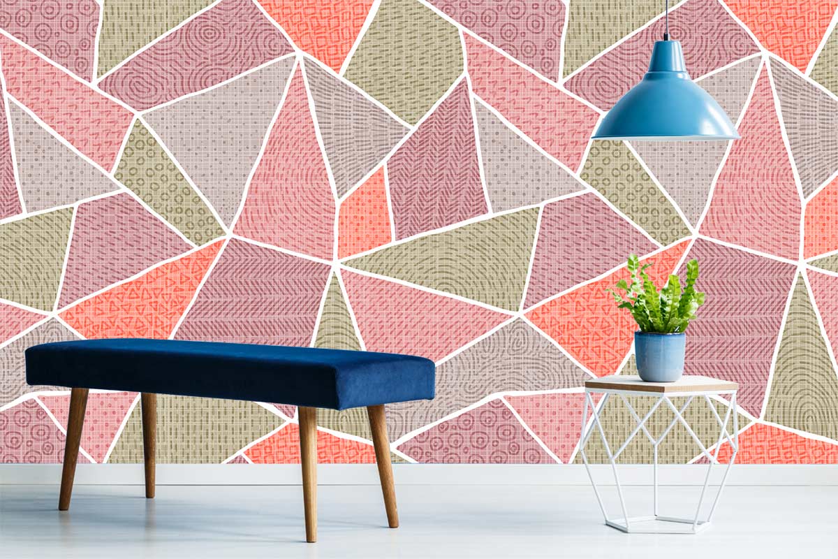 Vintage geo patchwork wallpaper in pink, green, orange with blue bench, white table, pendant light.