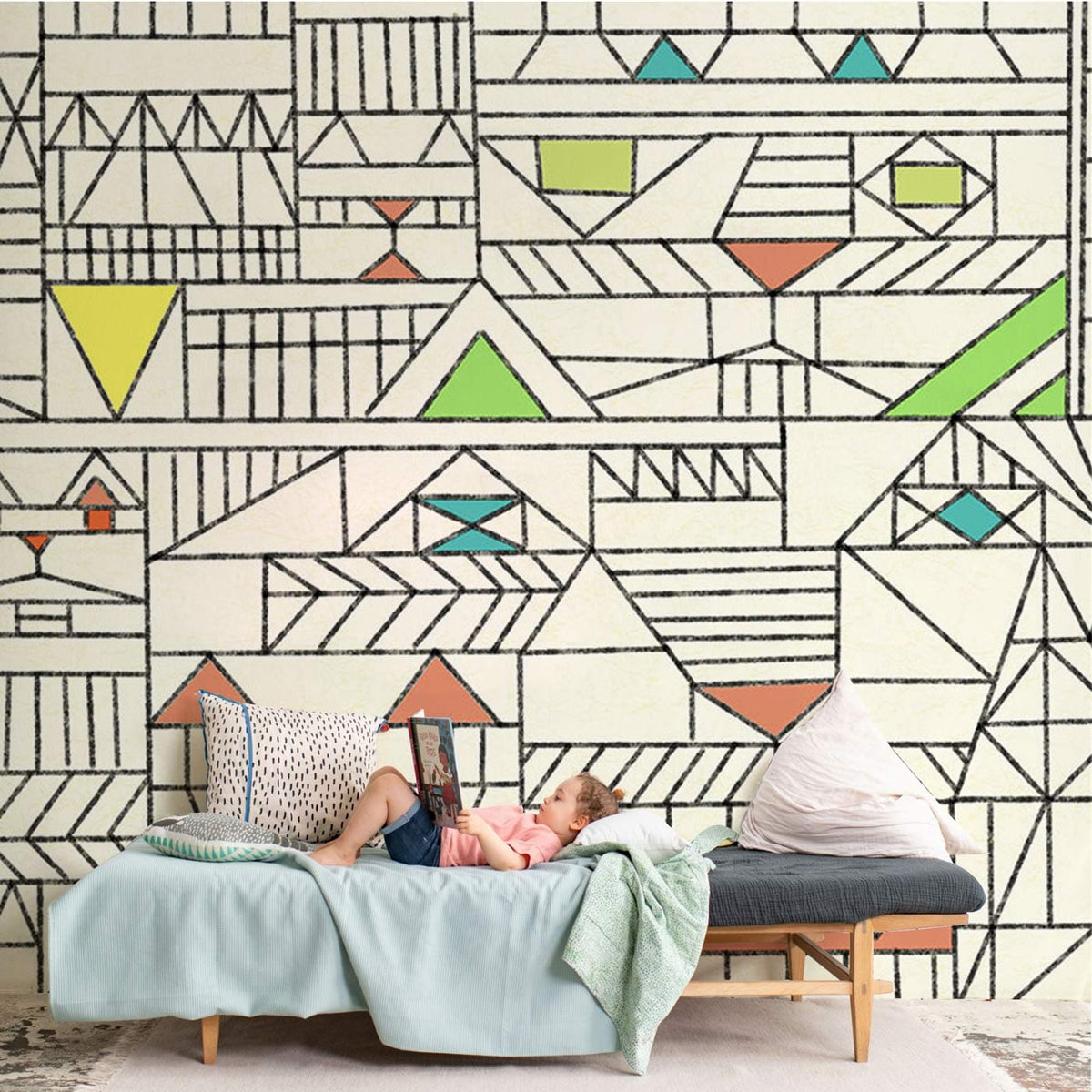 Geometric retro pastel wallpaper in cream, soft hues; child on pastel sofa, modern decor elements.