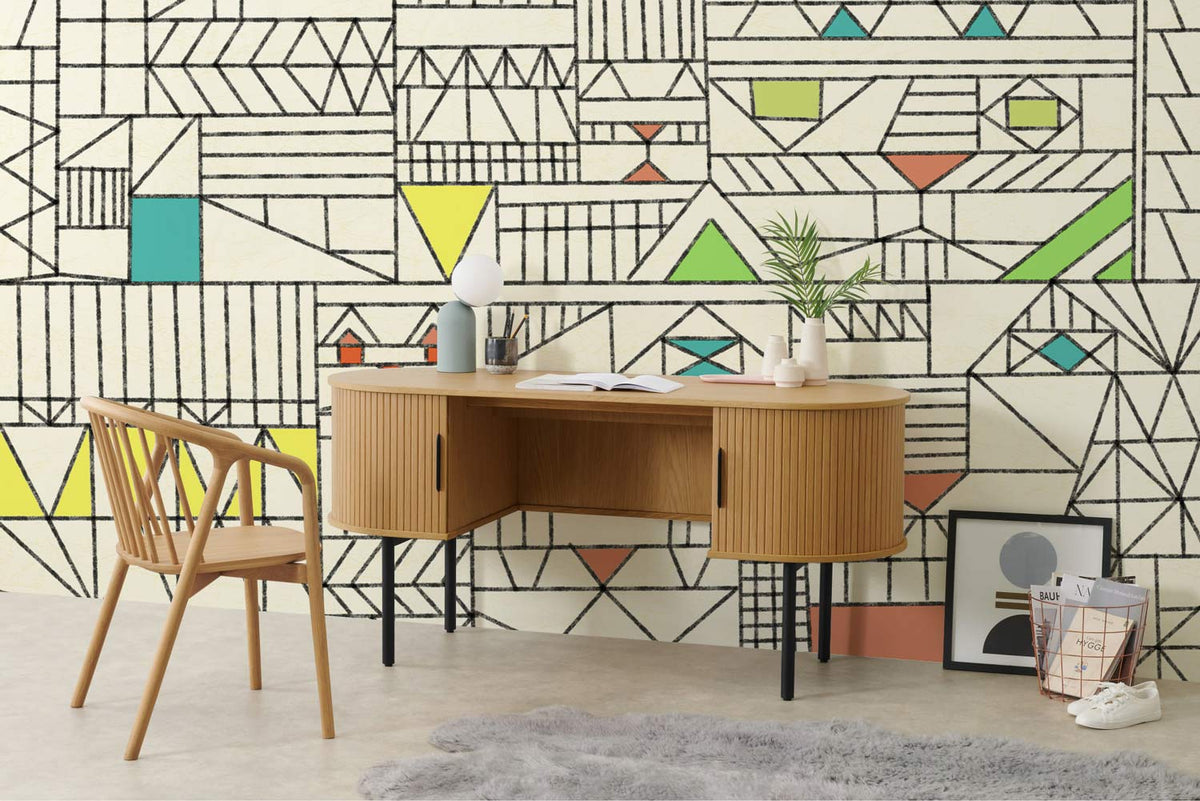 Geometric Retro Pastel Pattern Wallpaper in Cream with Wooden Desk, Chair, and Soft Rug in Study.